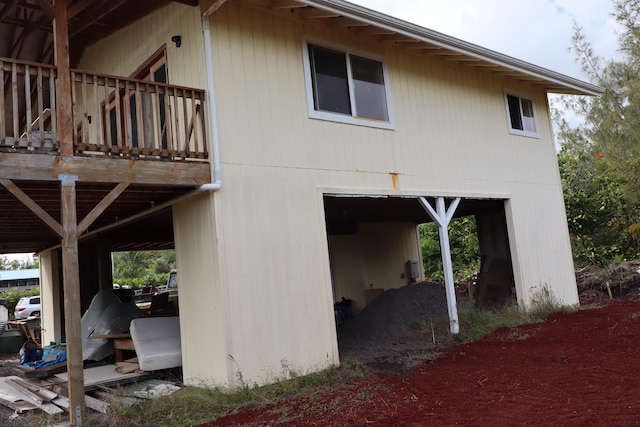 view of side of home with a balcony