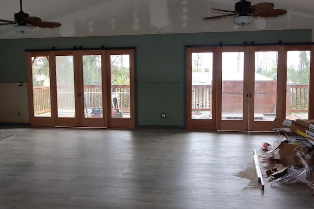 entryway with french doors, ceiling fan, lofted ceiling, and wood-type flooring