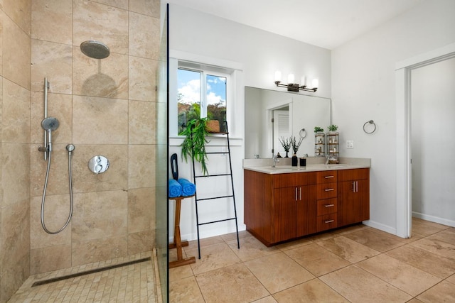 bathroom featuring vanity and tiled shower