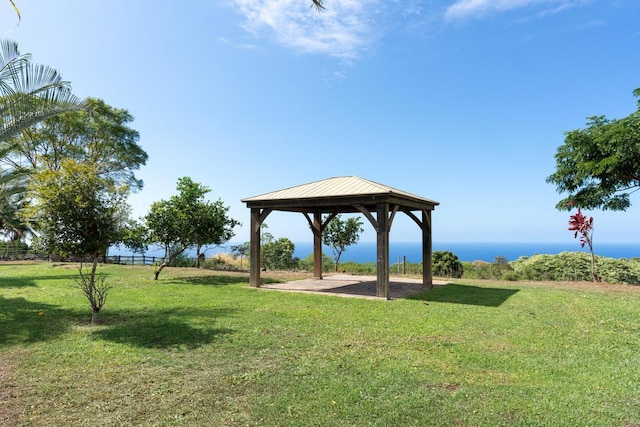 surrounding community featuring a water view, a gazebo, and a yard