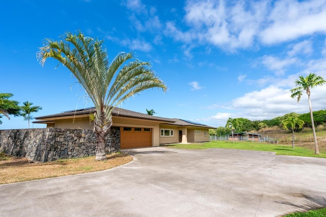 single story home with a garage