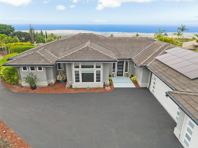 single story home featuring a water view