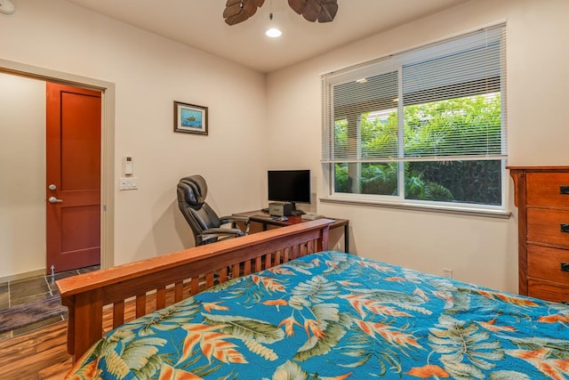 bedroom featuring hardwood / wood-style flooring and ceiling fan