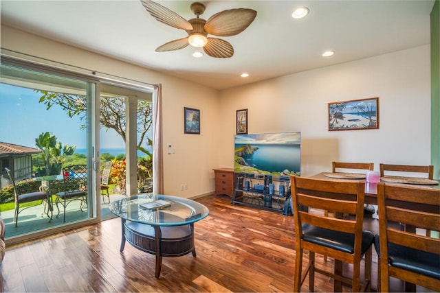 interior space with ceiling fan and wood-type flooring