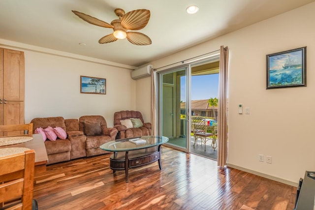 living room with an AC wall unit, ceiling fan, and hardwood / wood-style flooring