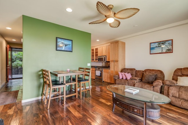 living room with dark hardwood / wood-style floors and ceiling fan