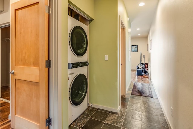 washroom with stacked washer and dryer