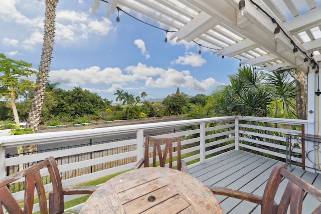 wooden terrace with a pergola