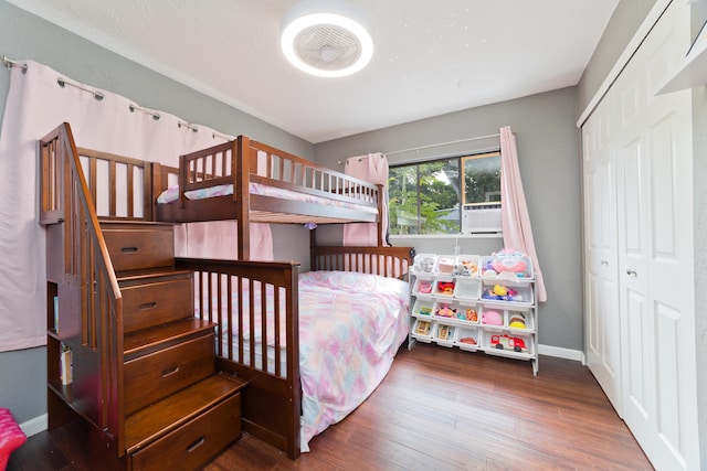 bedroom featuring a closet and dark hardwood / wood-style floors