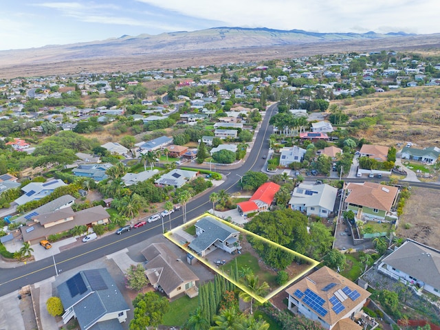 birds eye view of property with a mountain view