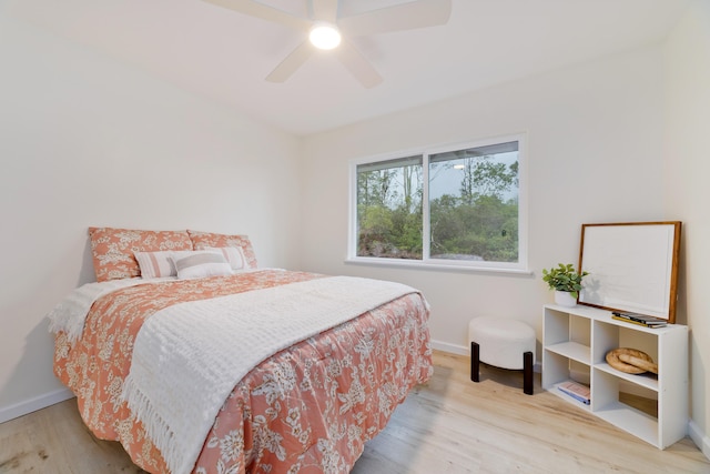 bedroom with ceiling fan and light wood-type flooring