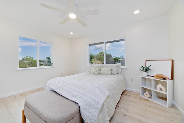 bedroom featuring ceiling fan and light hardwood / wood-style floors