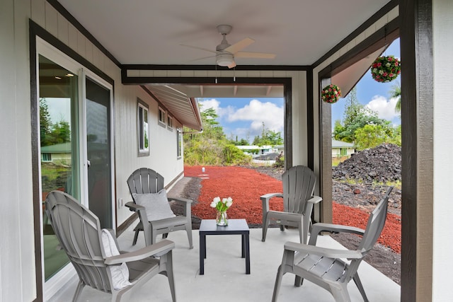 sunroom / solarium featuring ceiling fan