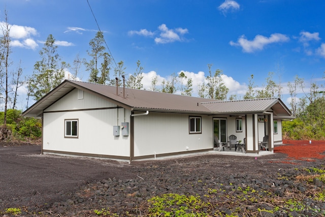 rear view of house with a patio