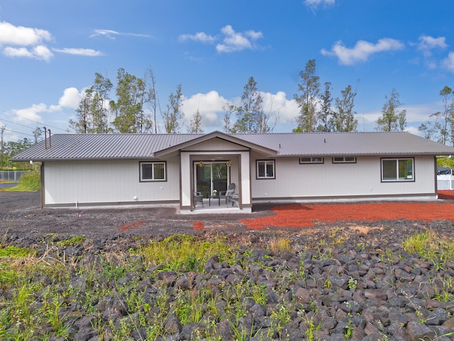 back of property featuring a patio area