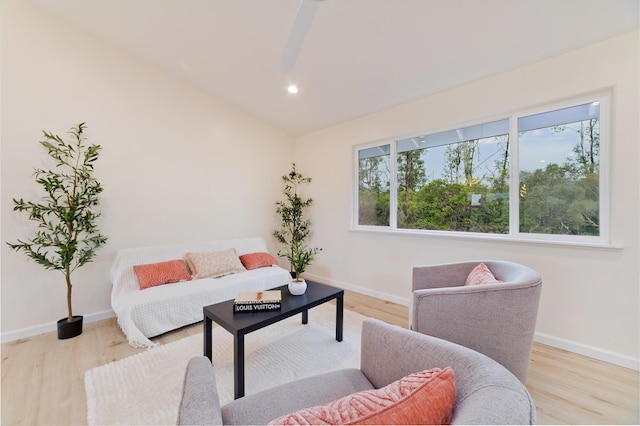 living room featuring plenty of natural light and light hardwood / wood-style flooring