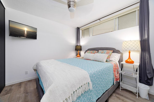 bedroom featuring wood-type flooring and ceiling fan