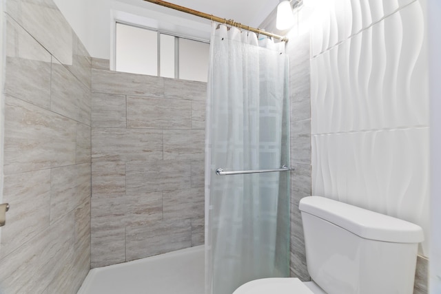 bathroom with toilet and curtained shower