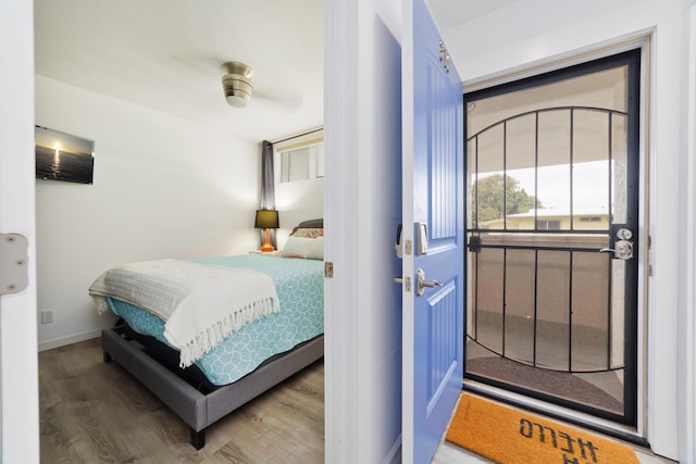 bedroom featuring hardwood / wood-style floors and ceiling fan