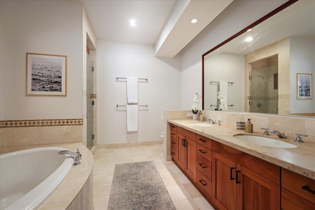 full bathroom featuring tile patterned flooring, plus walk in shower, vanity, and toilet