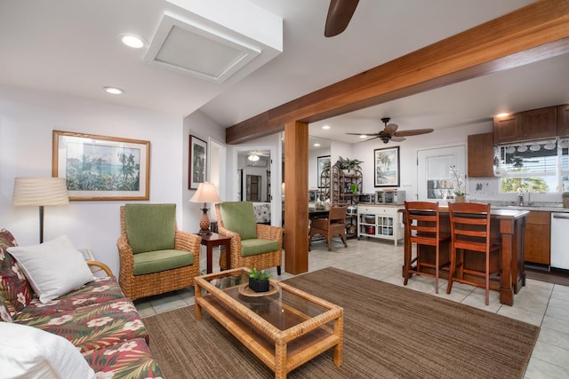 tiled living room with ceiling fan and beam ceiling