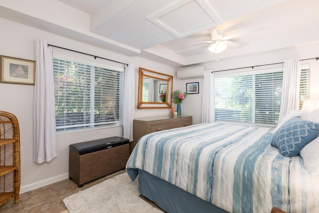 tiled bedroom with a wall unit AC and ceiling fan