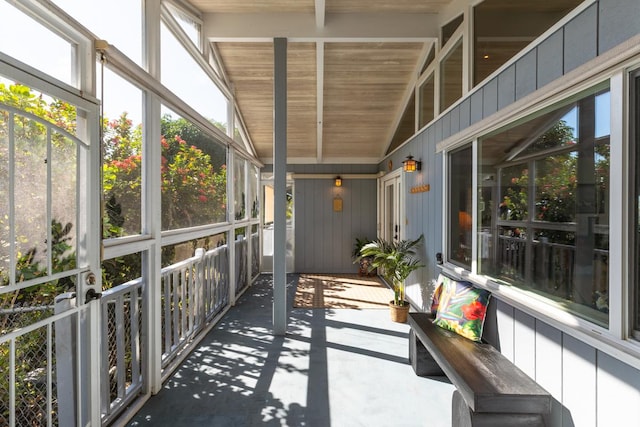 sunroom featuring wooden ceiling and vaulted ceiling