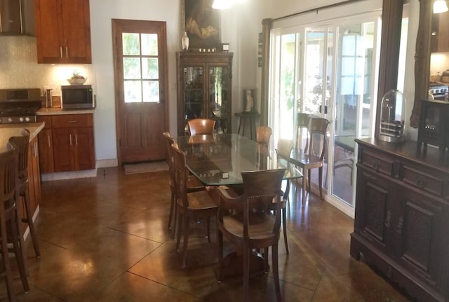 tiled dining area with a wealth of natural light