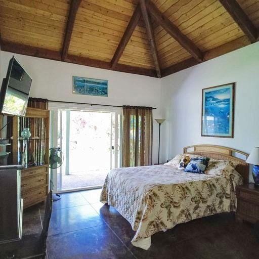 tiled bedroom featuring wooden ceiling, access to exterior, beam ceiling, and high vaulted ceiling