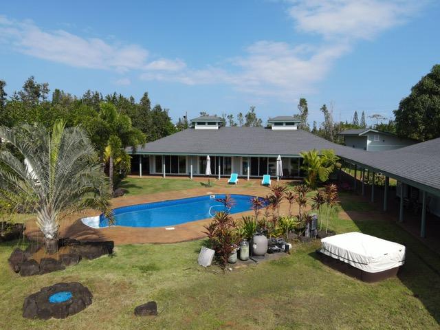 view of pool with a yard