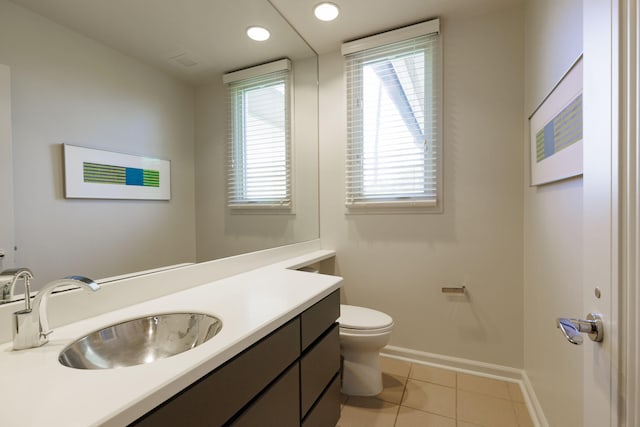 bathroom featuring vanity, tile patterned flooring, and toilet