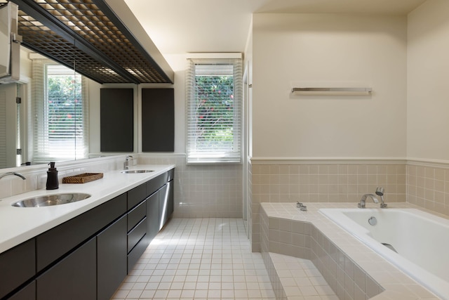 bathroom with vanity, plenty of natural light, and tile patterned floors