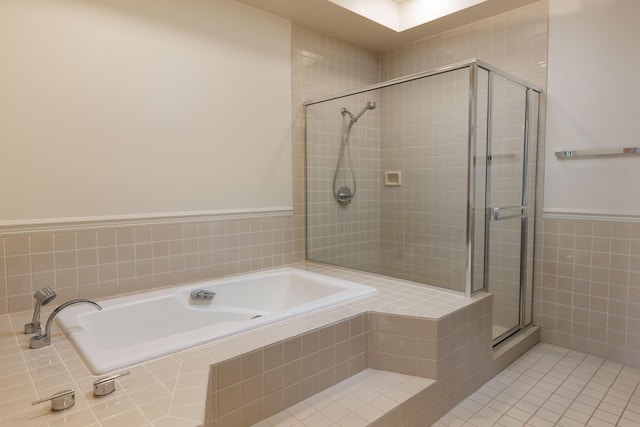 bathroom with tile patterned flooring and a shower with shower door