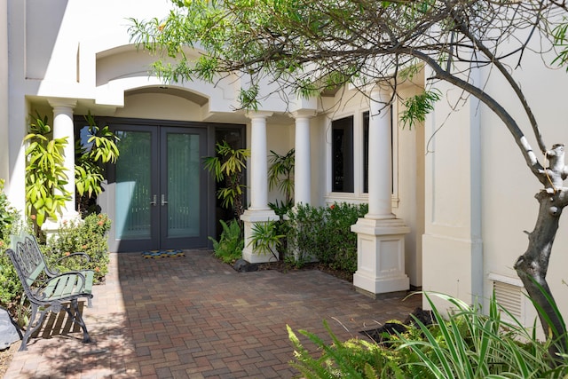 view of exterior entry featuring french doors