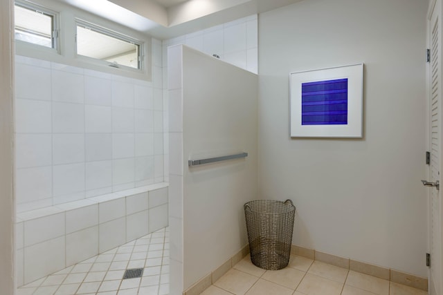 bathroom with tile patterned floors and a shower