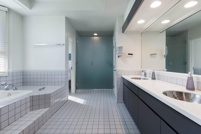 bathroom with vanity, tile patterned floors, and separate shower and tub