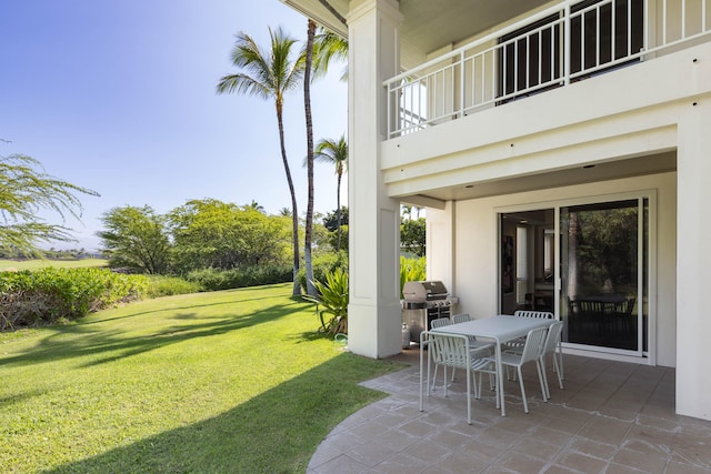 view of yard featuring a balcony and a patio area