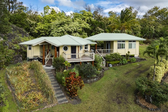 view of front of house featuring a front yard and covered porch