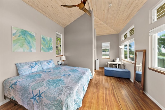 bedroom with hardwood / wood-style flooring, ceiling fan, high vaulted ceiling, and wood ceiling