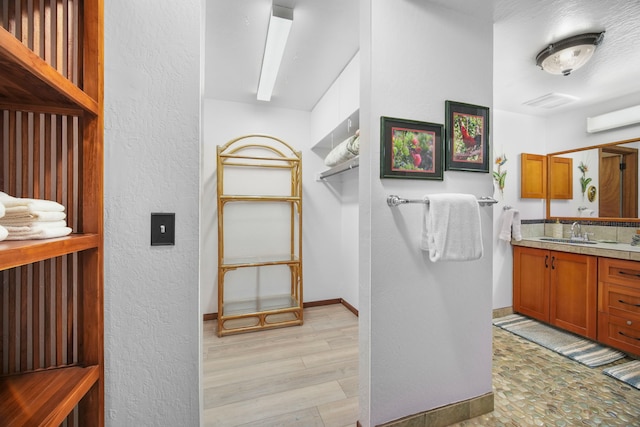 bathroom featuring vanity and wood-type flooring