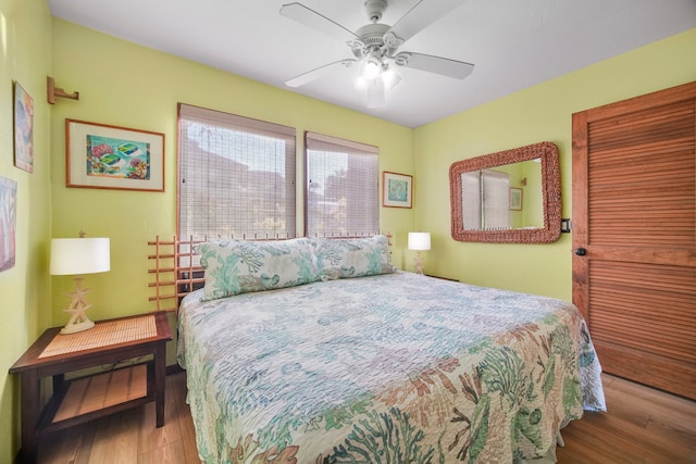 bedroom with ceiling fan and light hardwood / wood-style floors