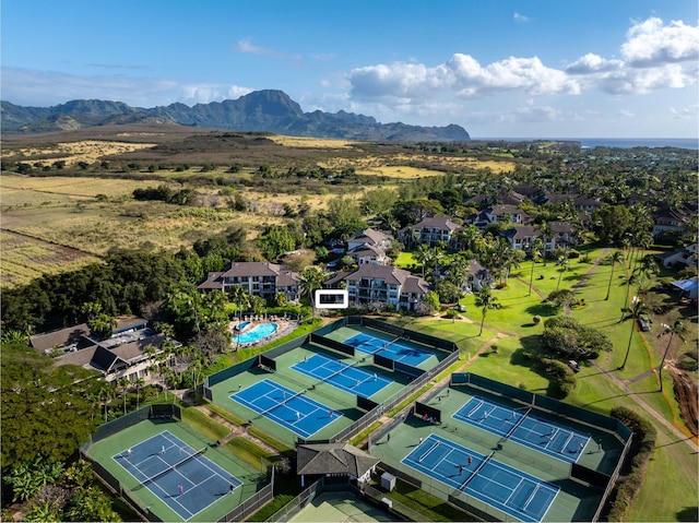 birds eye view of property with a mountain view