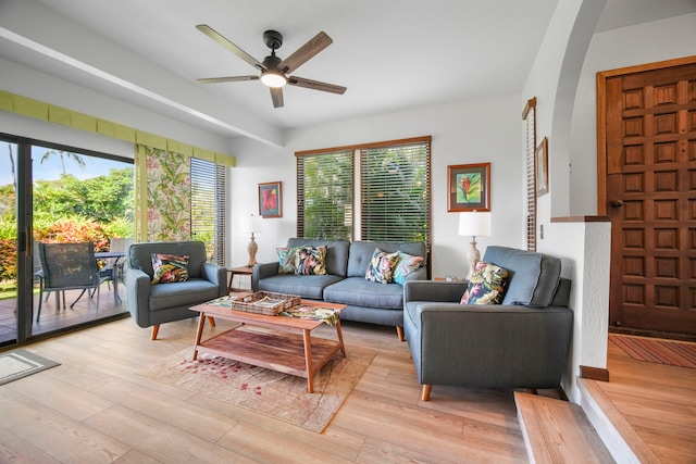 living room featuring light hardwood / wood-style floors and ceiling fan