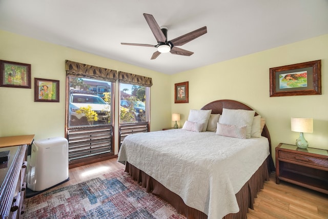 bedroom featuring ceiling fan, access to outside, and light hardwood / wood-style floors