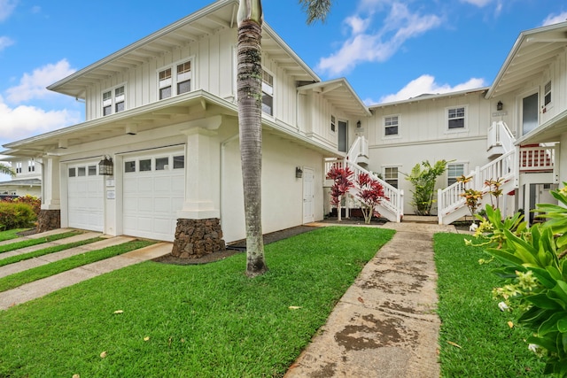 exterior space with a garage and a front yard