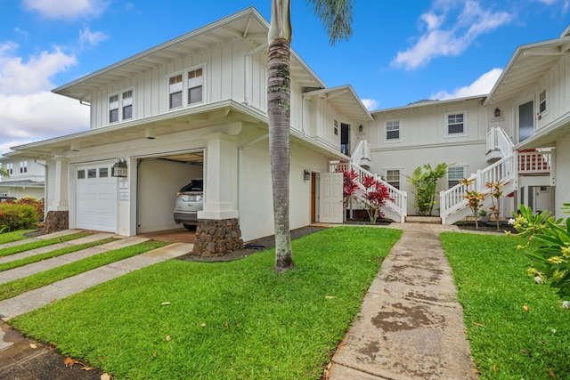 view of front facade featuring a garage and a front lawn