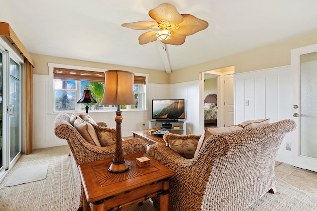 living room featuring lofted ceiling and ceiling fan