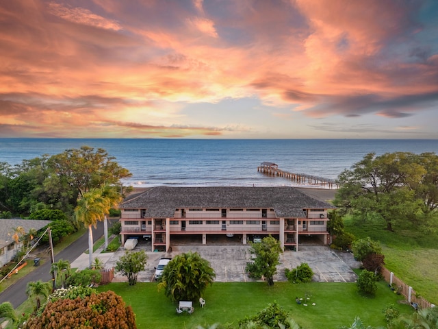 aerial view at dusk with a water view