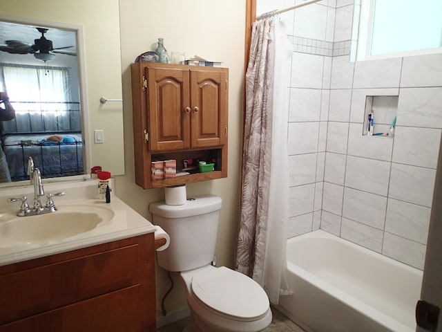 full bathroom featuring vanity, ceiling fan, toilet, and shower / tub combo with curtain