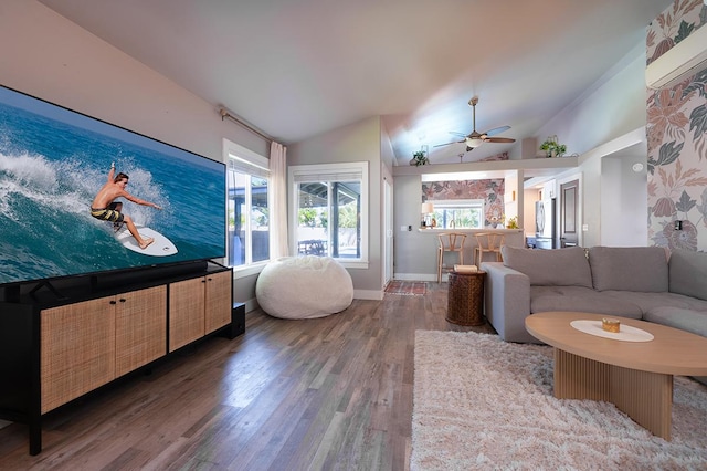 living room with dark wood-type flooring, lofted ceiling, and ceiling fan